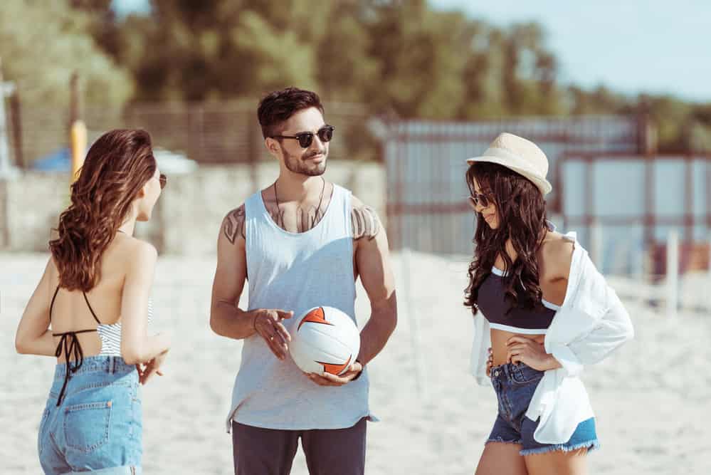 Friends playing volleyball on the beach